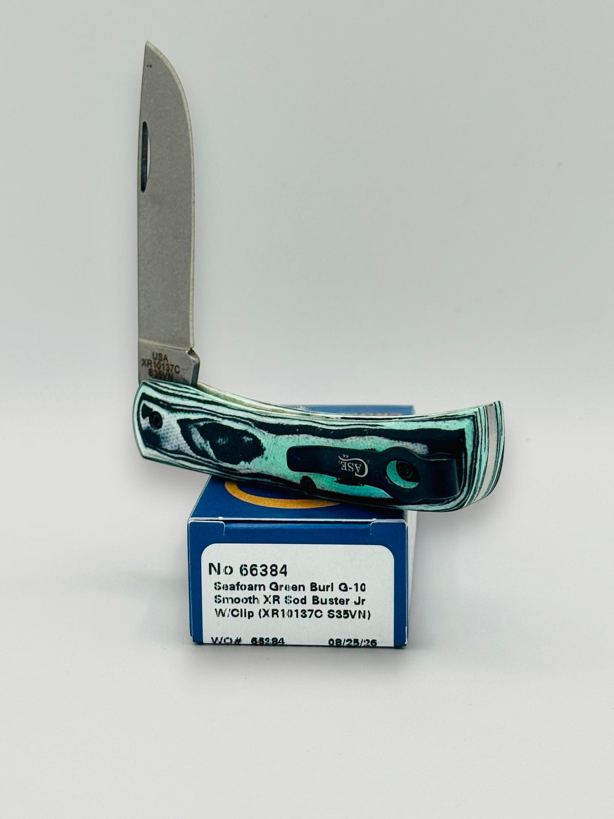Case XX 66384 Crossroads Seafoam G-10 Sod Buster Jr — handle and shield detail