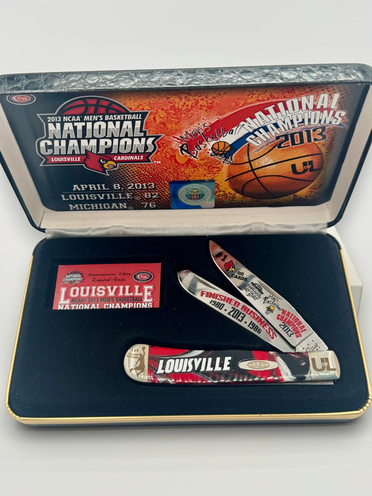 Case XX UofL 2013 Champs Corelon Trapper — blade detail on Case box