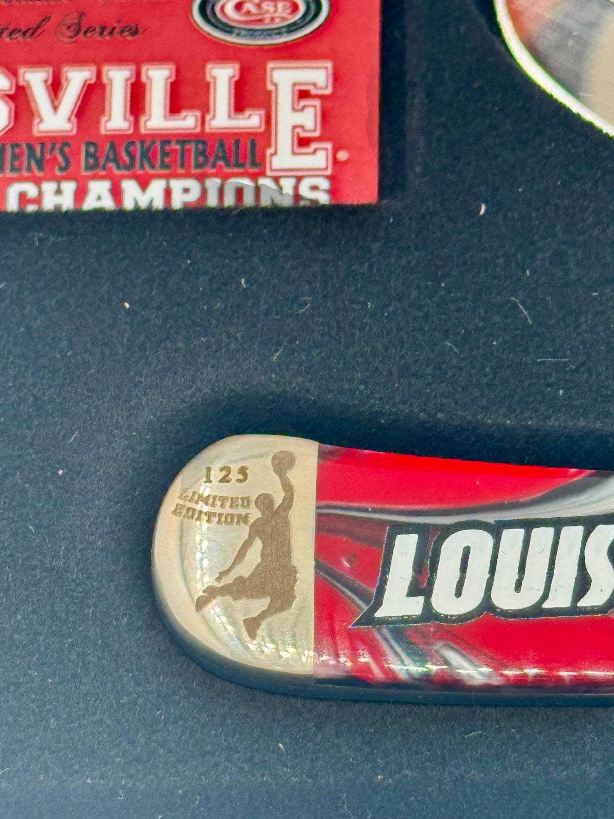 Case XX UofL 2013 Champs Corelon Trapper — handle and shield detail
