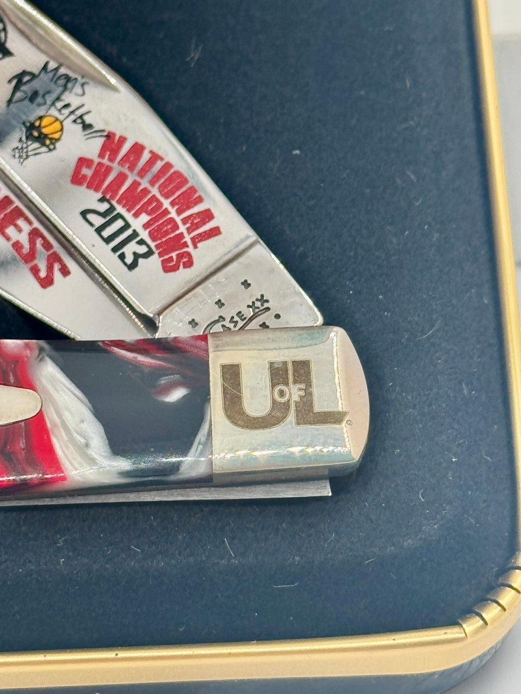 Case XX UofL 2013 Champs Corelon Trapper — back side on Case box