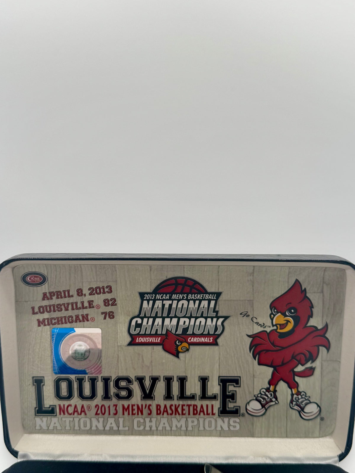 Case XX UofL 2013 Champs Bone Trapper — blade detail on Case box