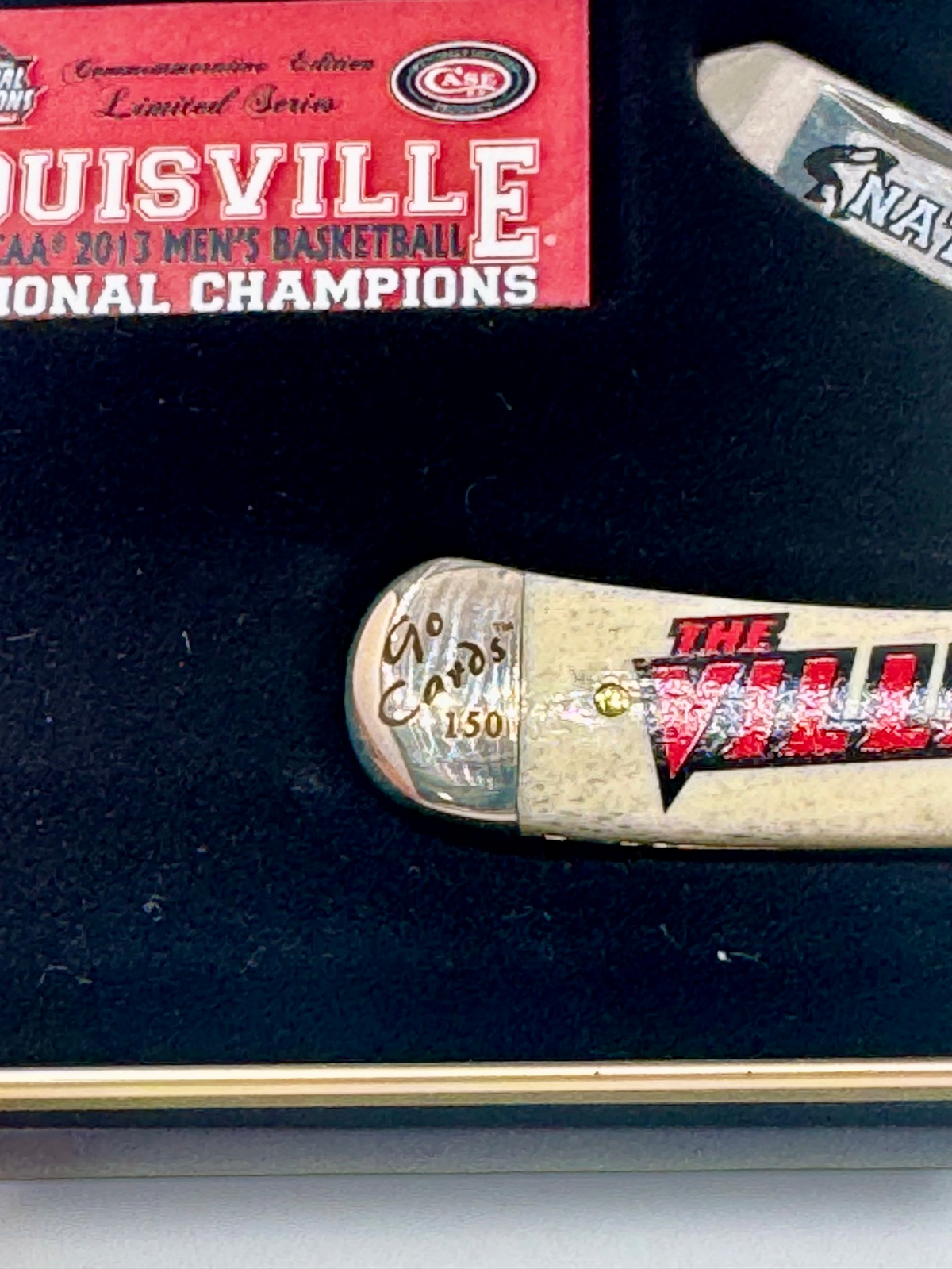 Case XX UofL 2013 Champs Bone Trapper — back side on Case box
