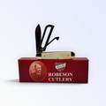 Pigeon Roost Knives Robeson Gamecock three-blade pocket knife with white smooth bone handle and mirror-finish blades.