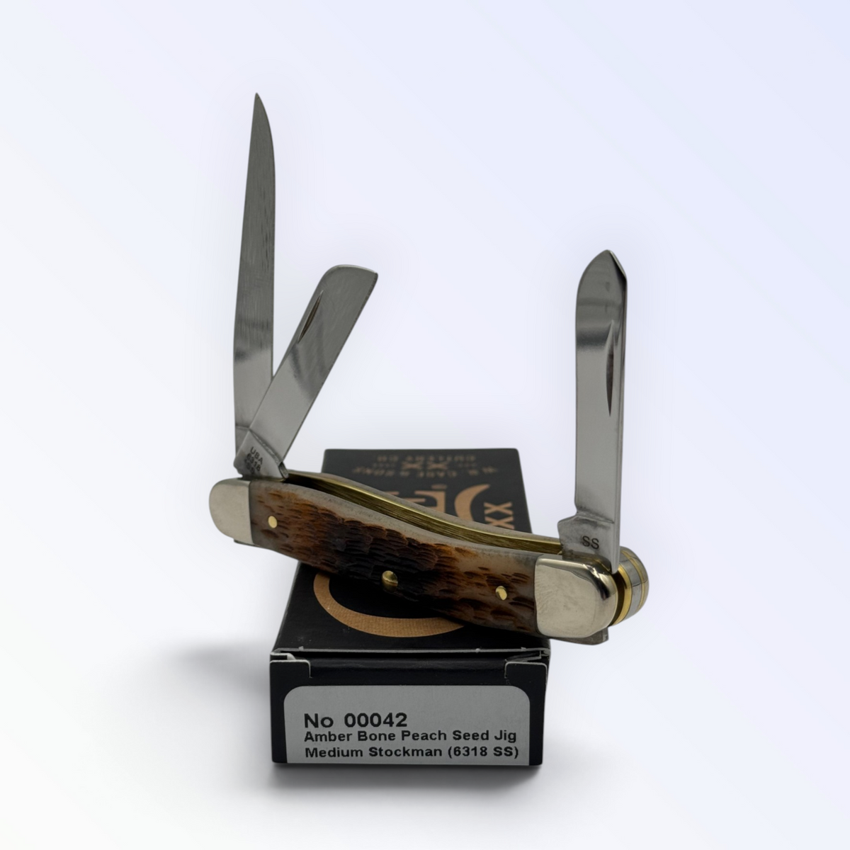 Pigeon Roost Knives Case XX Medium Stockman pocket knife with peach seed jigged amber bone handle and three blades
