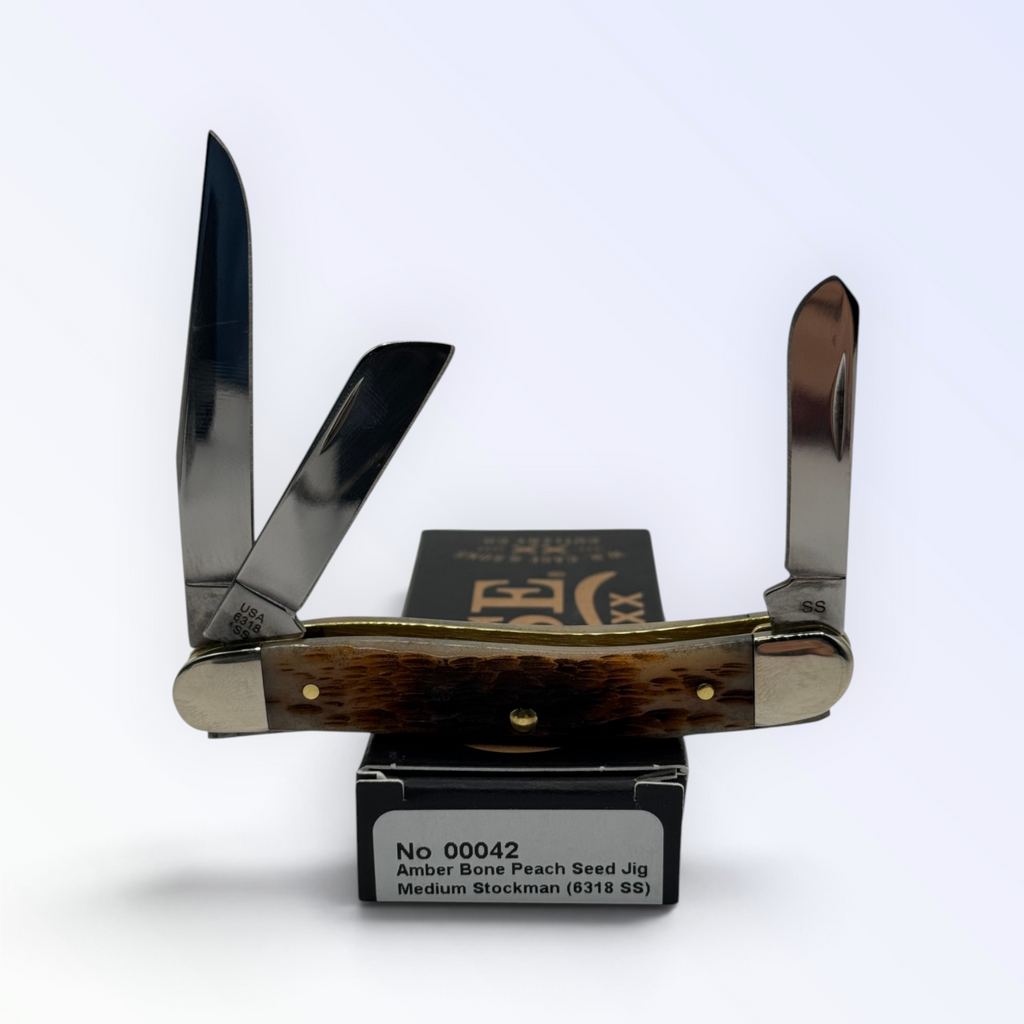 Pigeon Roost Knives Case XX Medium Stockman pocket knife with peach seed jigged amber bone handle and three steel blades