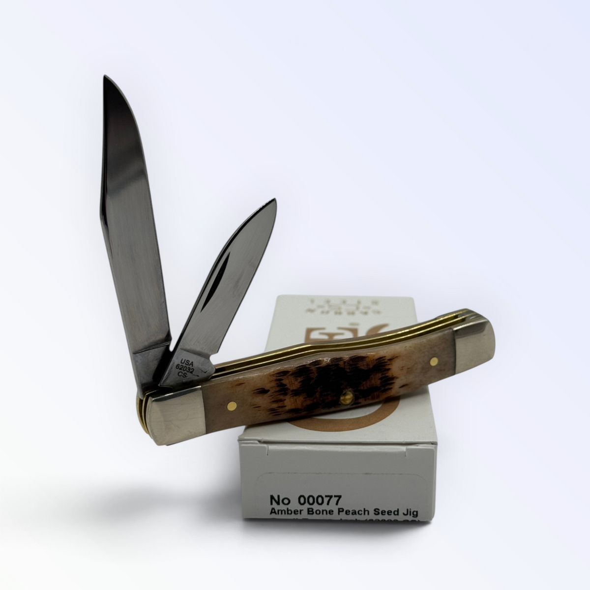 Pigeon Roost Knives Case XX Texas Jack pocket knife with amber peach seed jigged bone handle and two carbon steel blades