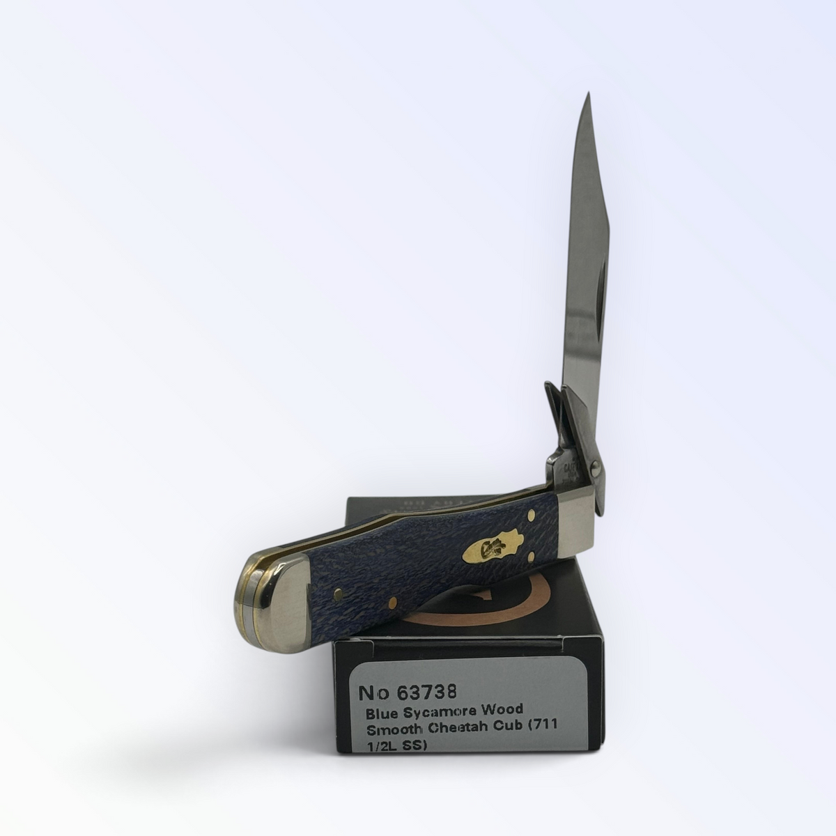 Pigeon Roost Knives Case XX Cheetah Cub pocket knife with blue sycamore wood handle and swing guard open on its box