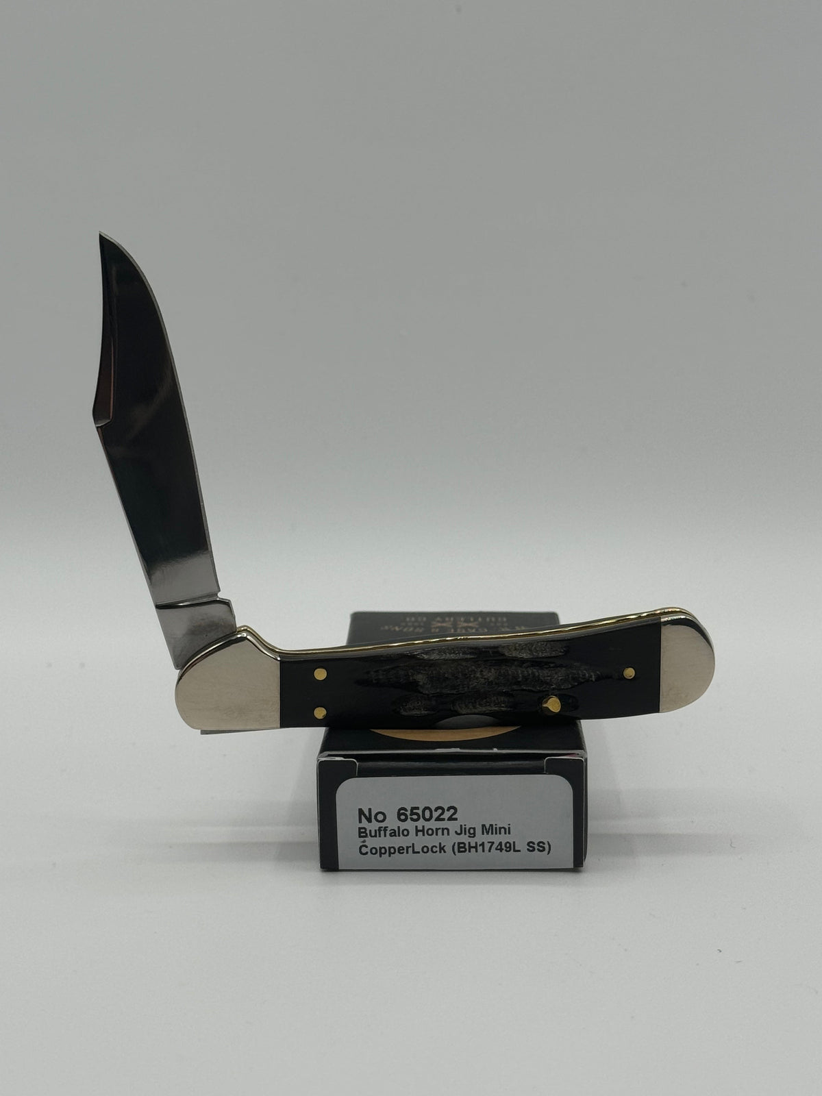 Pigeon Roost Knives Case XX Mini CopperLock pocket knife with jigged buffalo horn handle and locking clip blade.