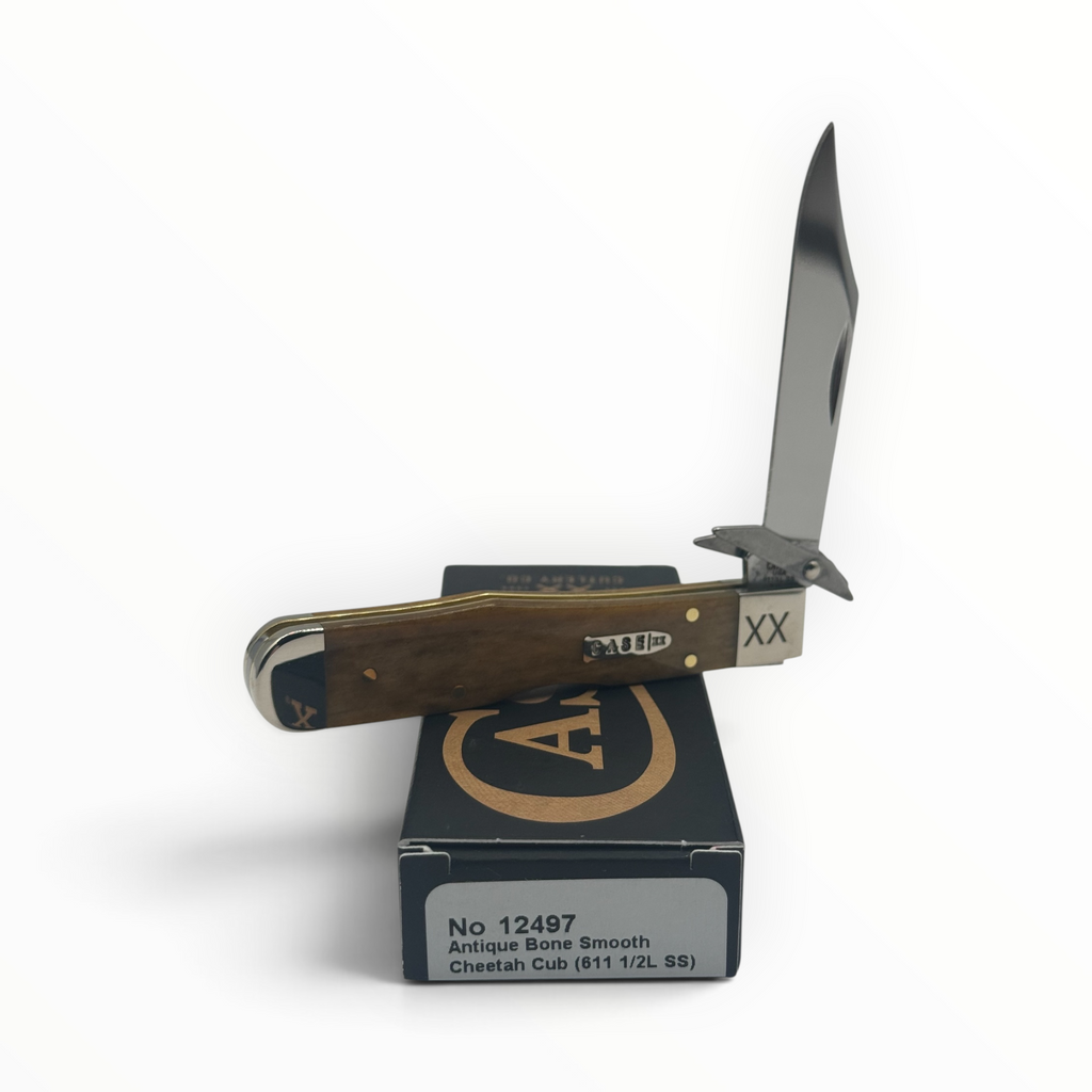 Pigeon Roost Knives Case XX Cheetah Cub with smooth antique bone handle and locking clip blade with swing guard.