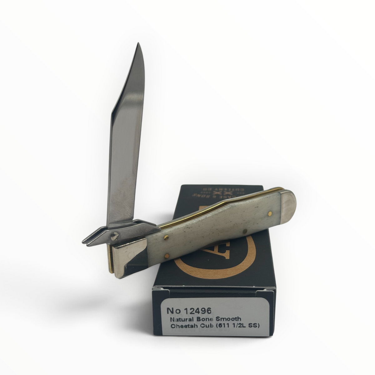 Pigeon Roost Knives Case XX Cheetah Cub pocket knife with smooth natural bone handle and swing guard on its box