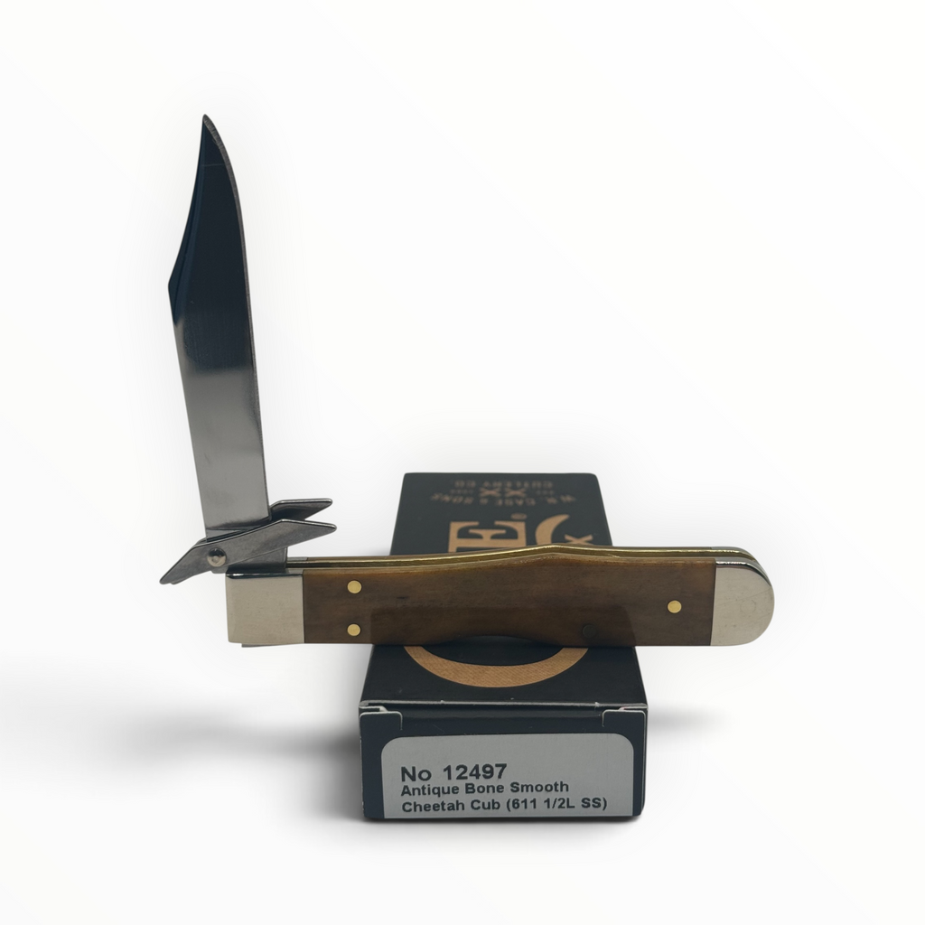 Pigeon Roost Knives Case XX Cheetah Cub with smooth antique bone handle, locking clip blade, and swing guard.