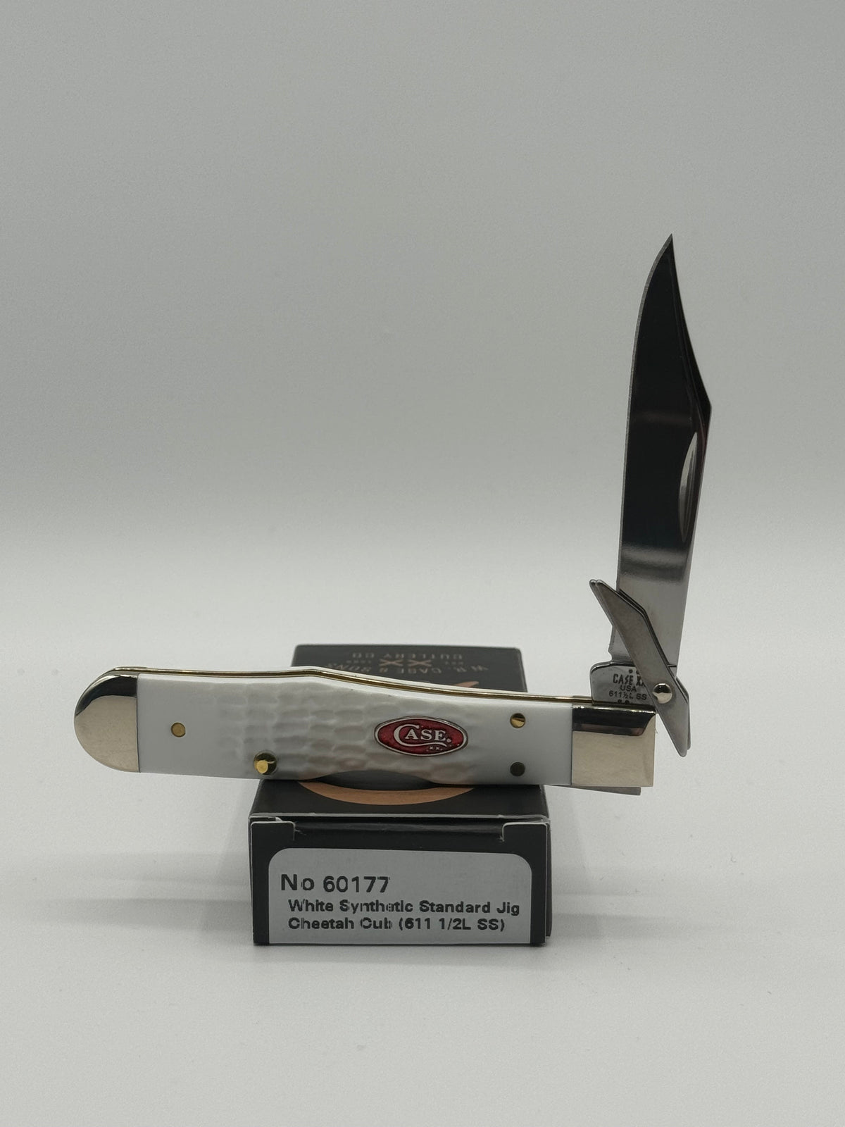 Pigeon Roost Knives Case XX SparXX Cheetah Cub pocket knife with white jigged synthetic handle and locking clip blade