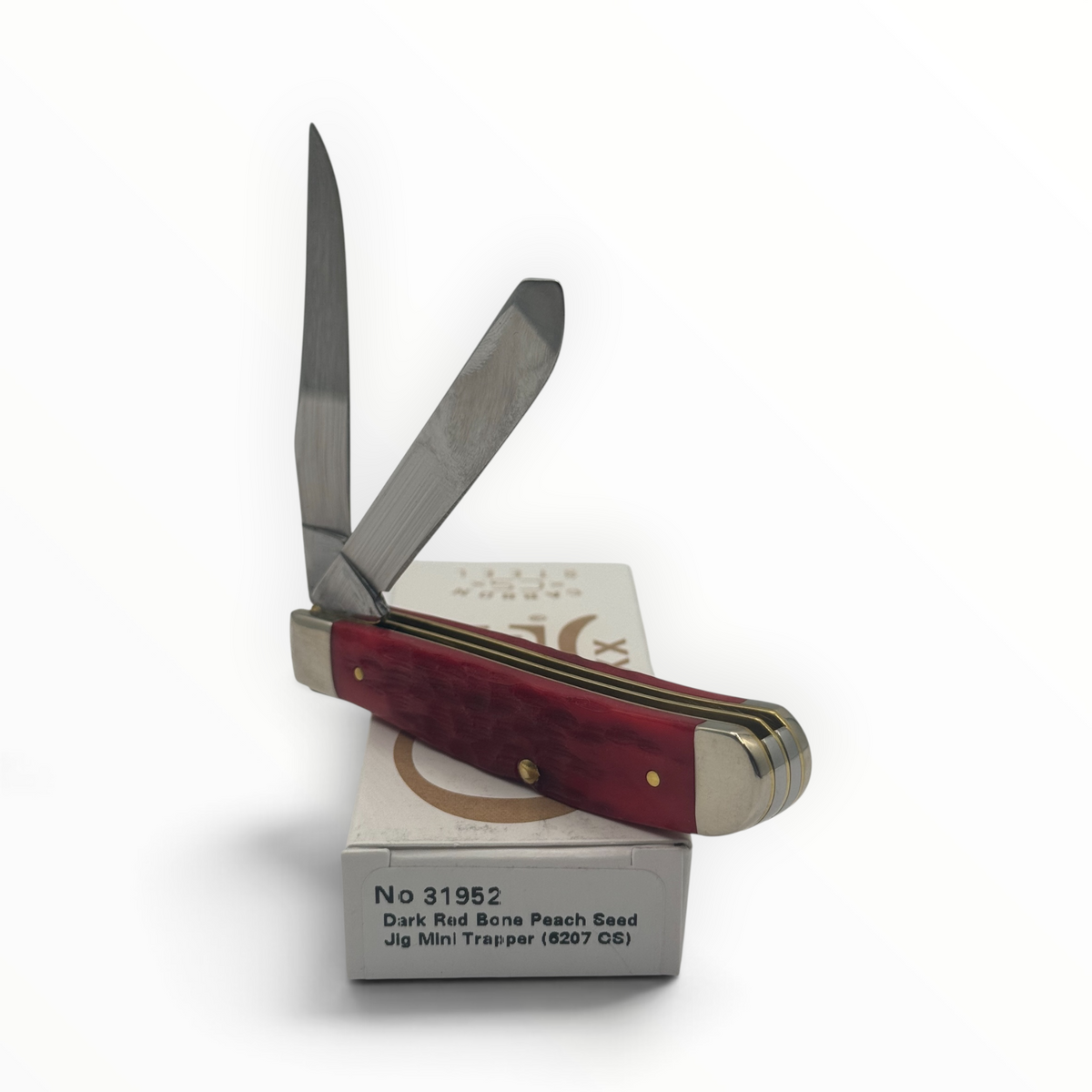 Pigeon Roost Knives Case XX Mini Trapper with dark red peach seed jigged bone handle and two carbon steel blades