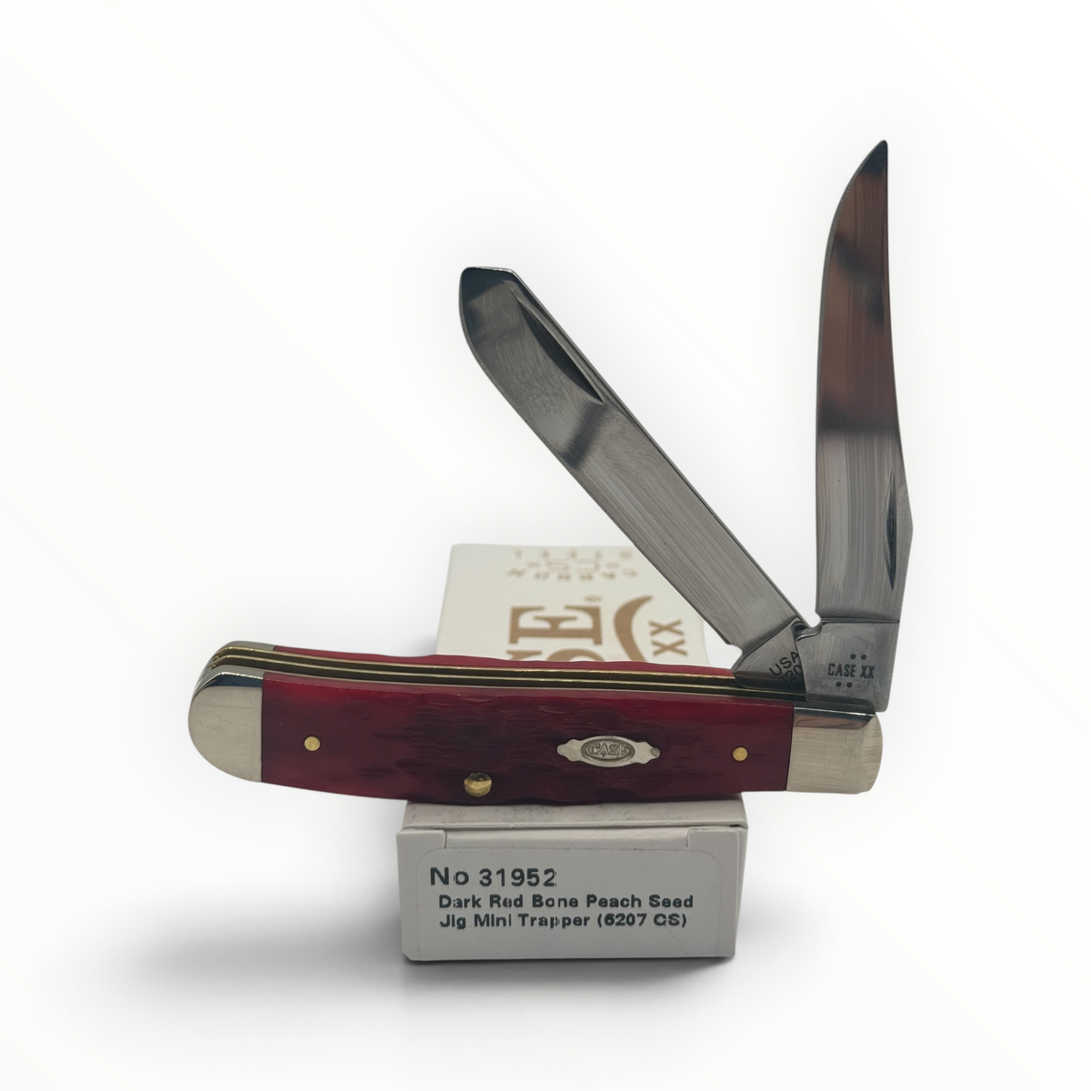Pigeon Roost Knives Case XX Mini Trapper with dark red jigged bone handle, two carbon steel blades, and box.