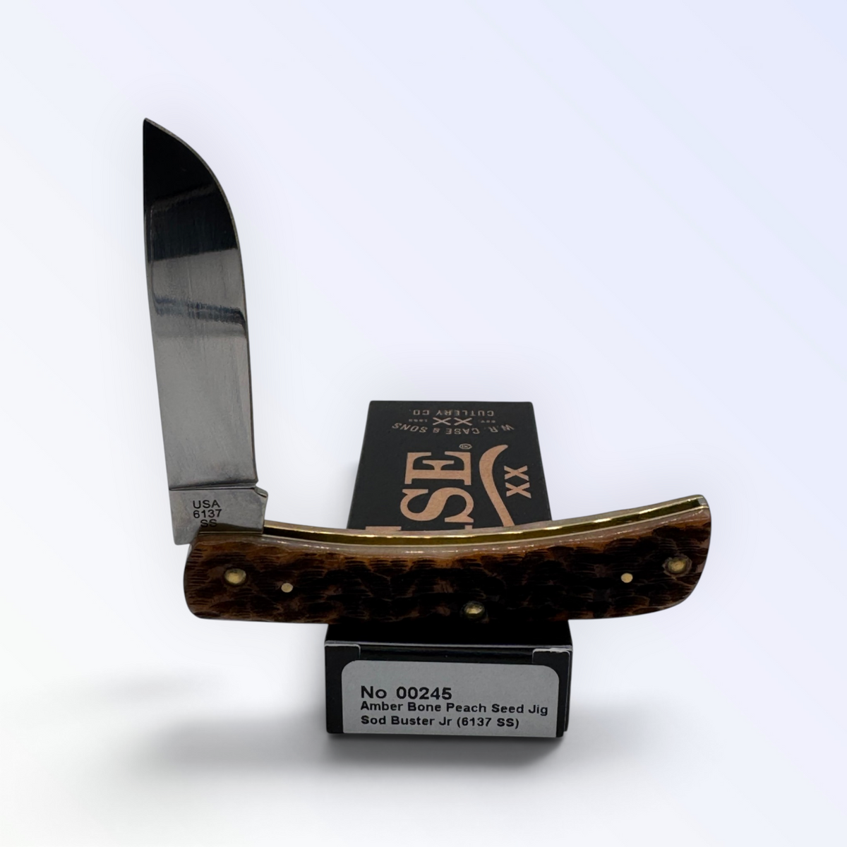 Pigeon Roost Knives Case XX Sod Buster Jr. pocket knife with amber bone peach seed jig handle and stainless steel blade