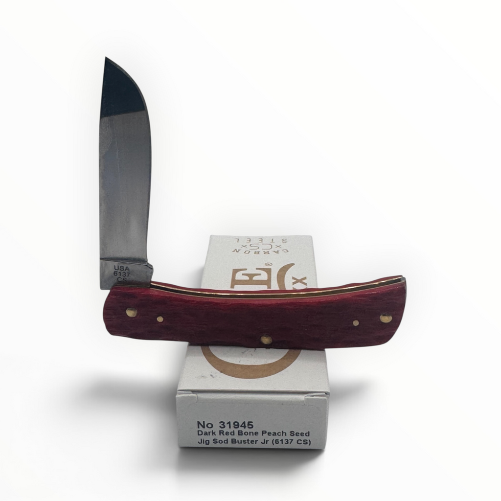 Pigeon Roost Knives Case XX Sod Buster Jr pocket knife with dark red peach seed jigged bone handle and skinner blade
