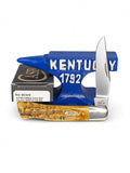 Case XX 65348 Case Axe Handle in 6.5 BoneStag — open blades resting on factory packaging