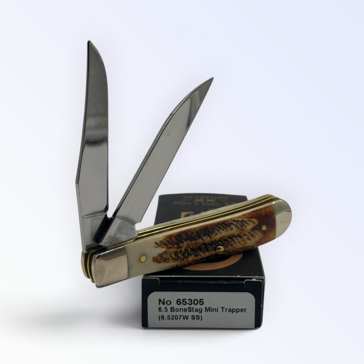 Case XX – 6.5 BoneStag Mini Trapper (65305) — pocket-knife studio shot on retail box