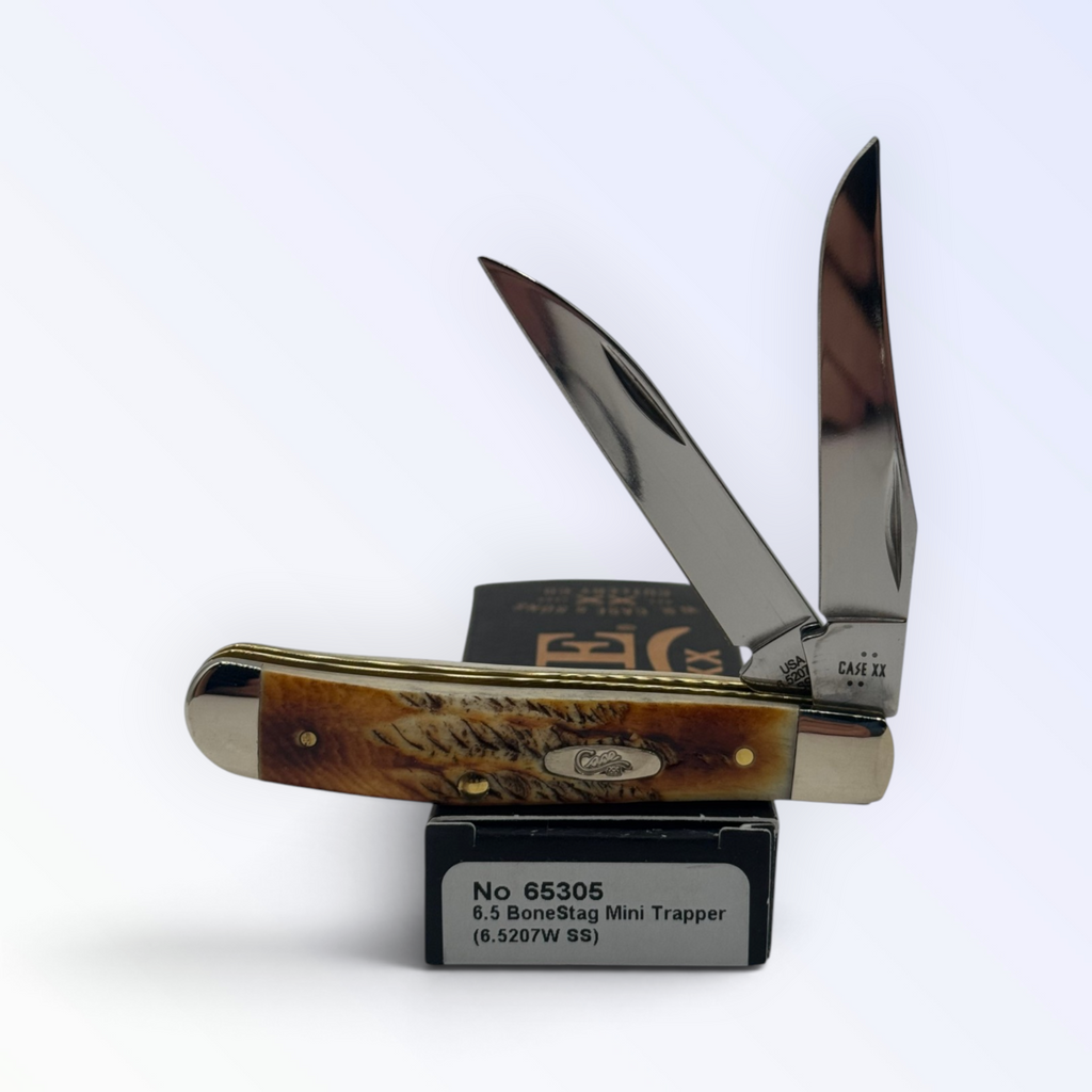 Case XX – 6.5 BoneStag Mini Trapper with SKU 65305 — blades open resting on the factory box