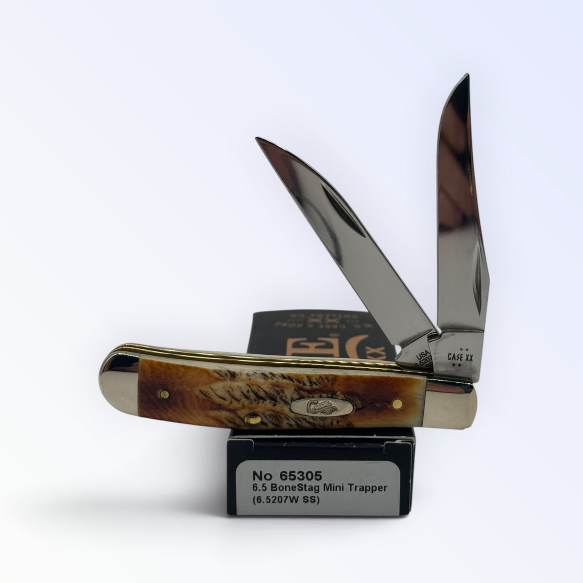 Case XX – 6.5 BoneStag Mini Trapper with SKU 65305 — blades open resting on the factory box