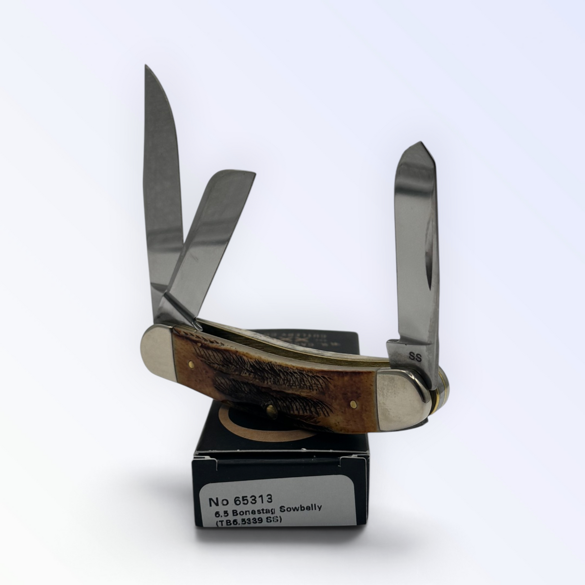 Catalog 65313 Case XX 6.5 Bonestag Sowbelly — open blades resting on factory packaging