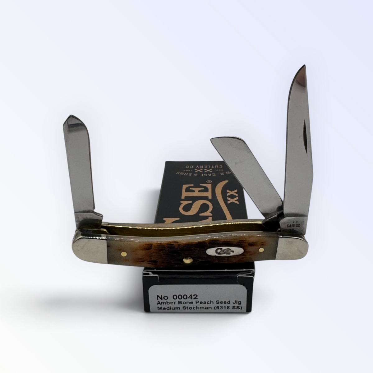 Pigeon Roost Knives Case XX Medium Stockman pocket knife with amber peach seed jigged bone handle and three blades 00042