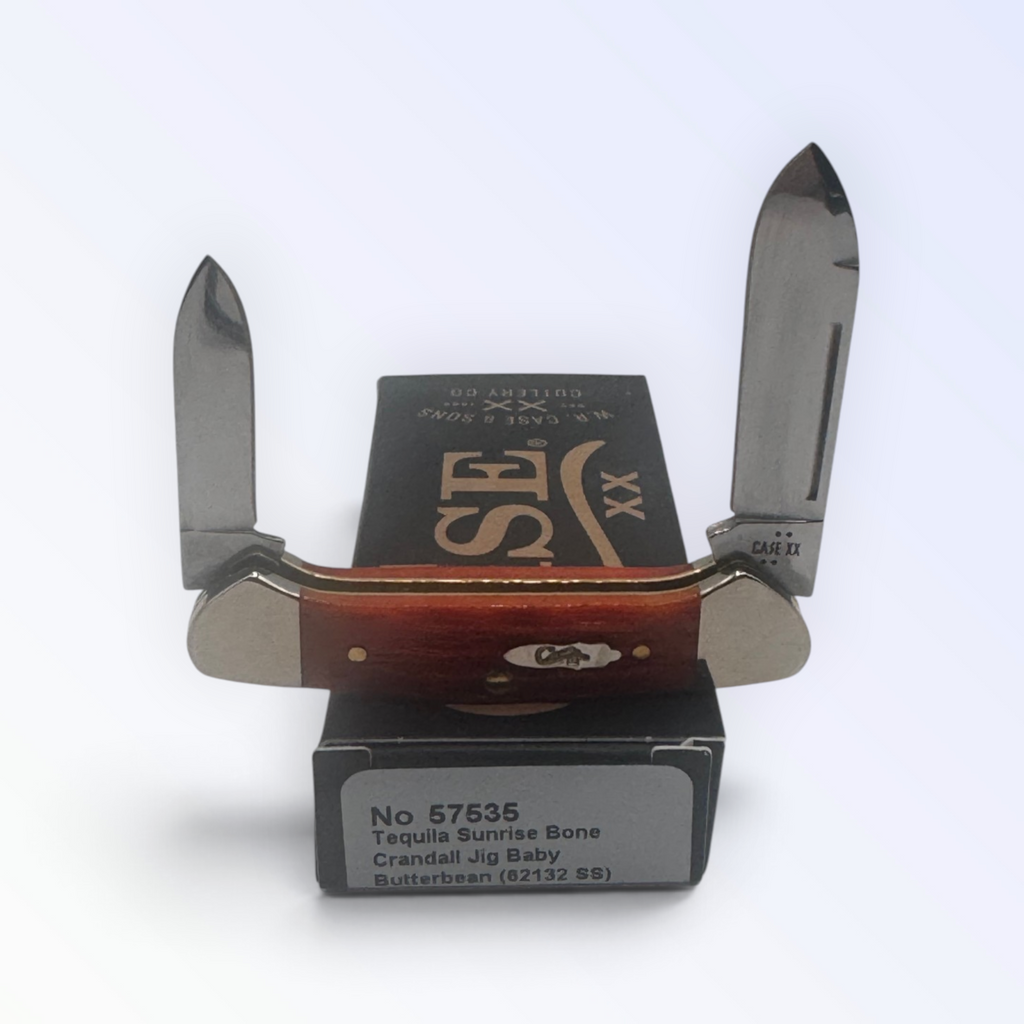 Case XX 57535 Baby Butterbean in Tequila Sunrise Bone Crandall Jig — open blades resting on factory packaging