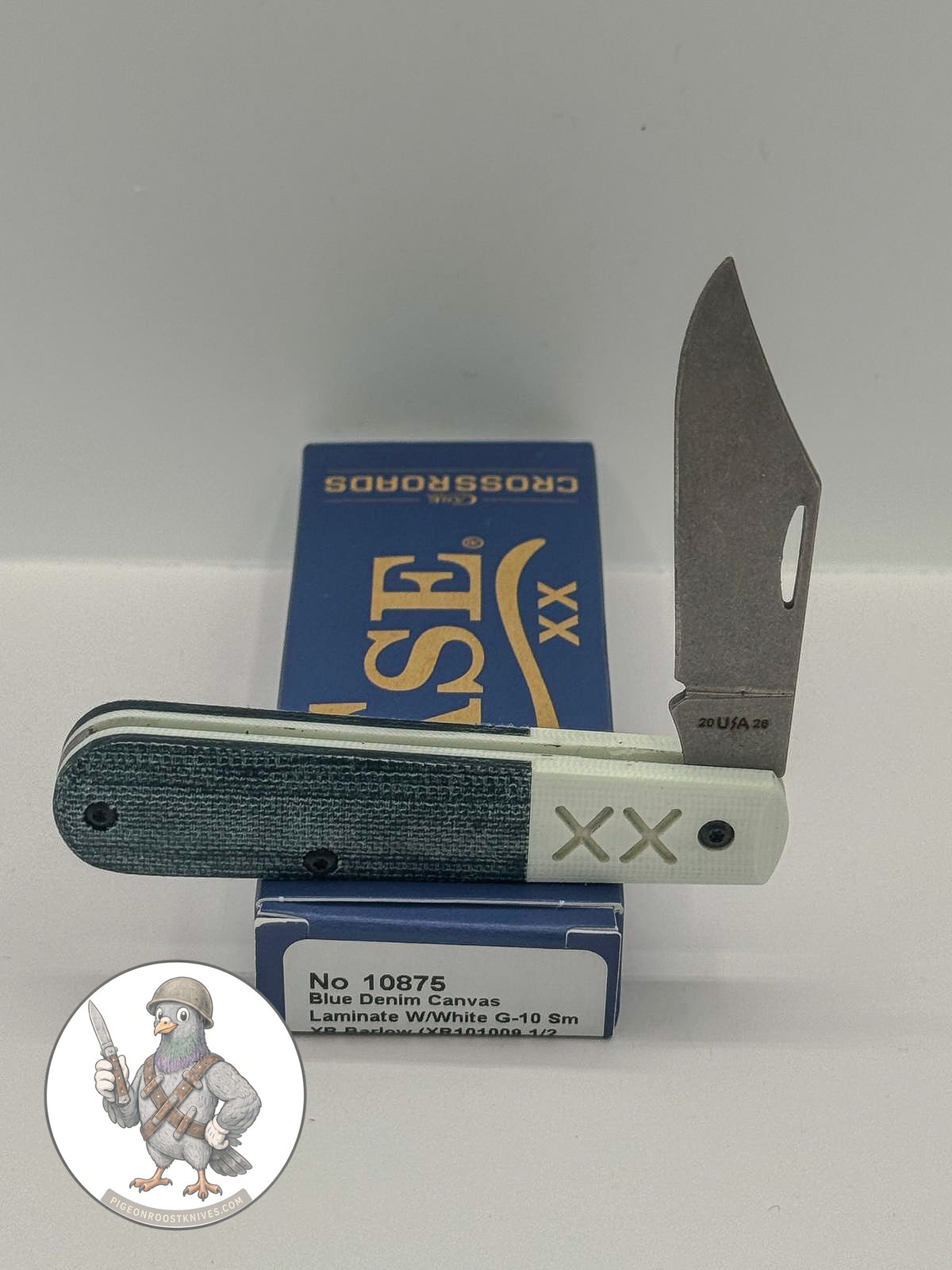 Case XX Barlow with Crossroads blue denim canvas with white G-10 and clip and pen blades, SKU 10875 — blades open resting on the factory box