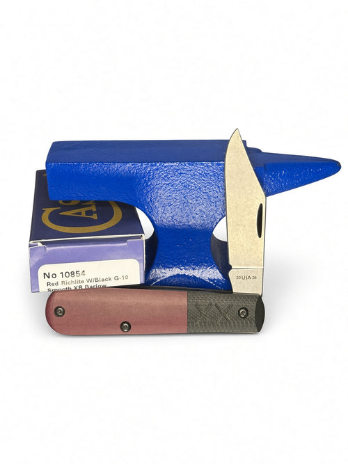 Case XX 10854 Barlow in Crossroads Red Richlite / Black G-10 Smooth XR — open blades resting on factory packaging