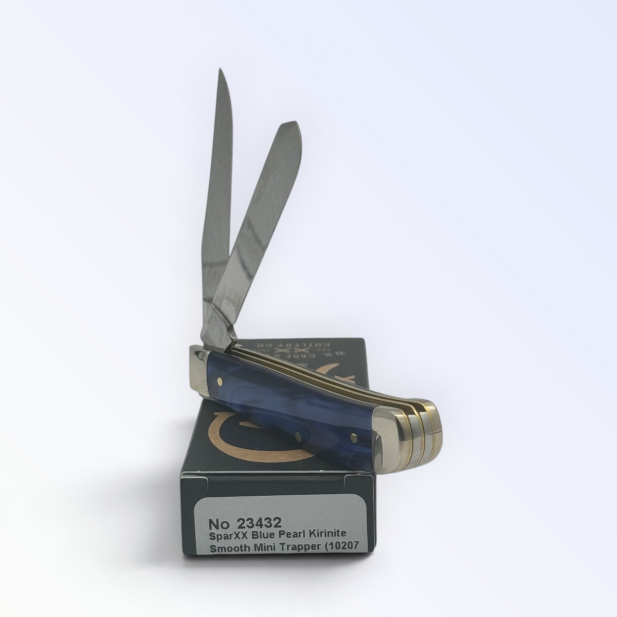 Catalog 23432 Case XX Blue Pearl Kirinite Mini Trapper — open blades resting on factory packaging
