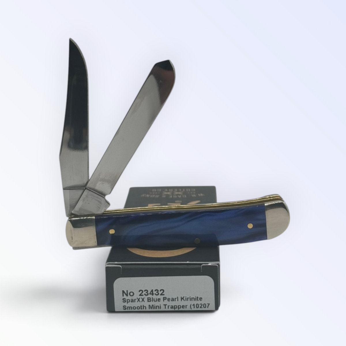 Blue Pearl Kirinite Mini Trapper by Case XX (23432), close view of handle texture with blades open on box