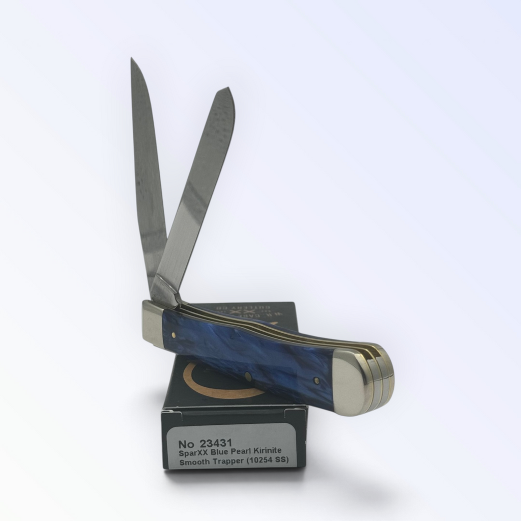 Catalog 23431 Case XX Blue Pearl Kirinite Trapper — open blades resting on factory packaging