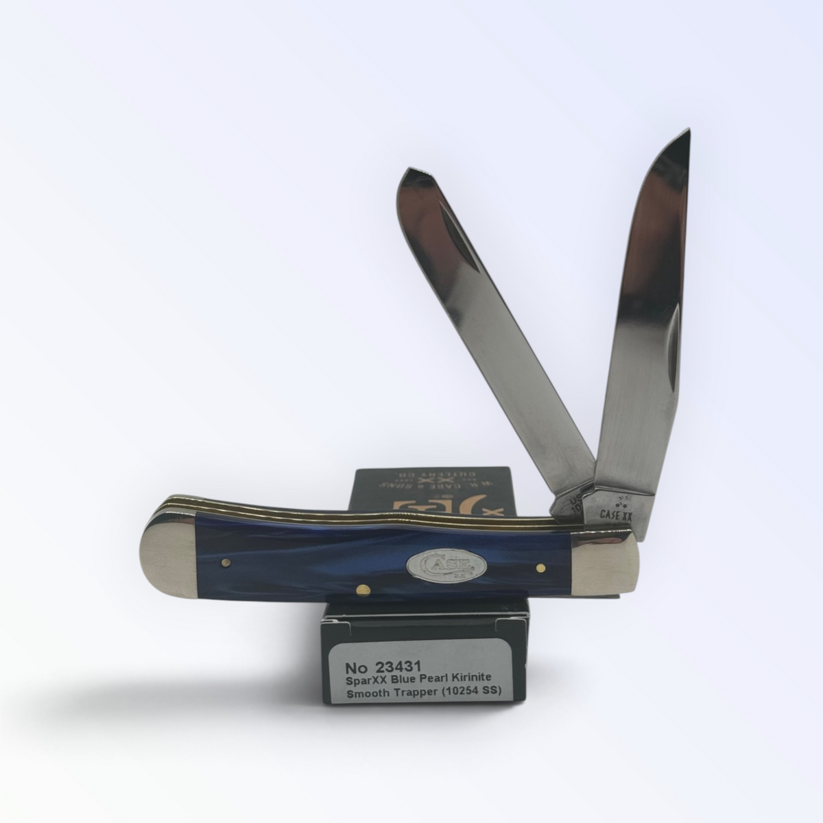 Case XX Blue Pearl Kirinite Trapper with SKU 23431 — blades open resting on the factory box