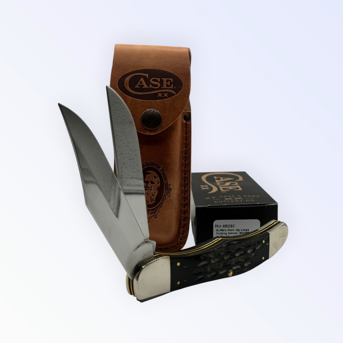 Pigeon Roost Knives Case XX Folding Hunter with jigged buffalo horn handle, two steel blades, and leather sheath.