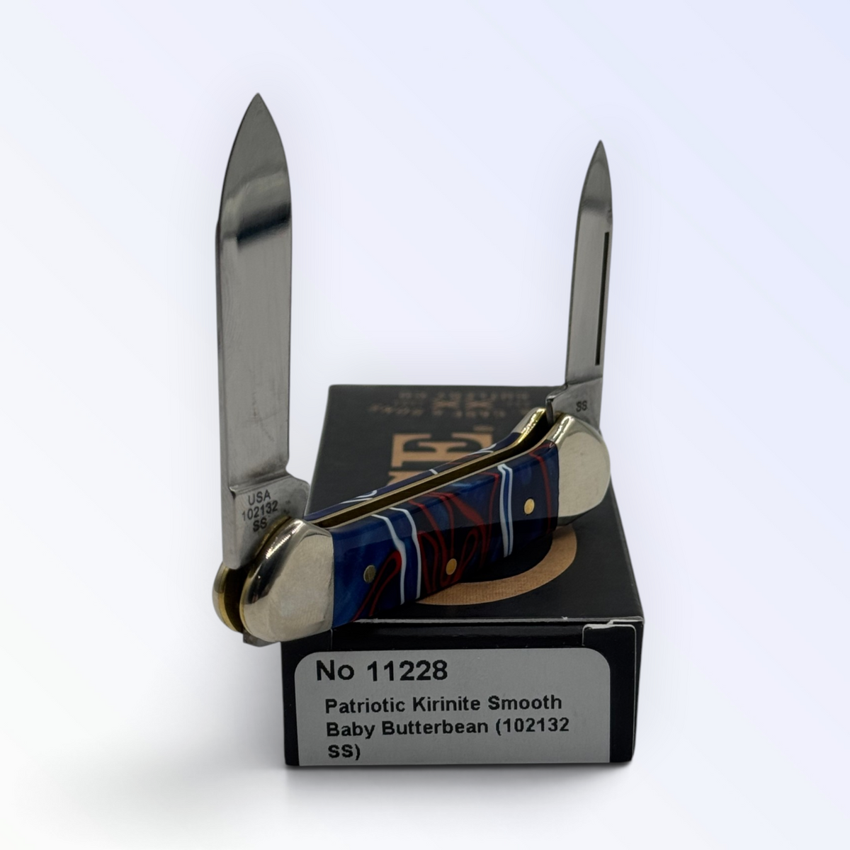 Catalog 11228 Case XX Butterbean — Patriotic Kirinite, close view of handle texture with blades open on box