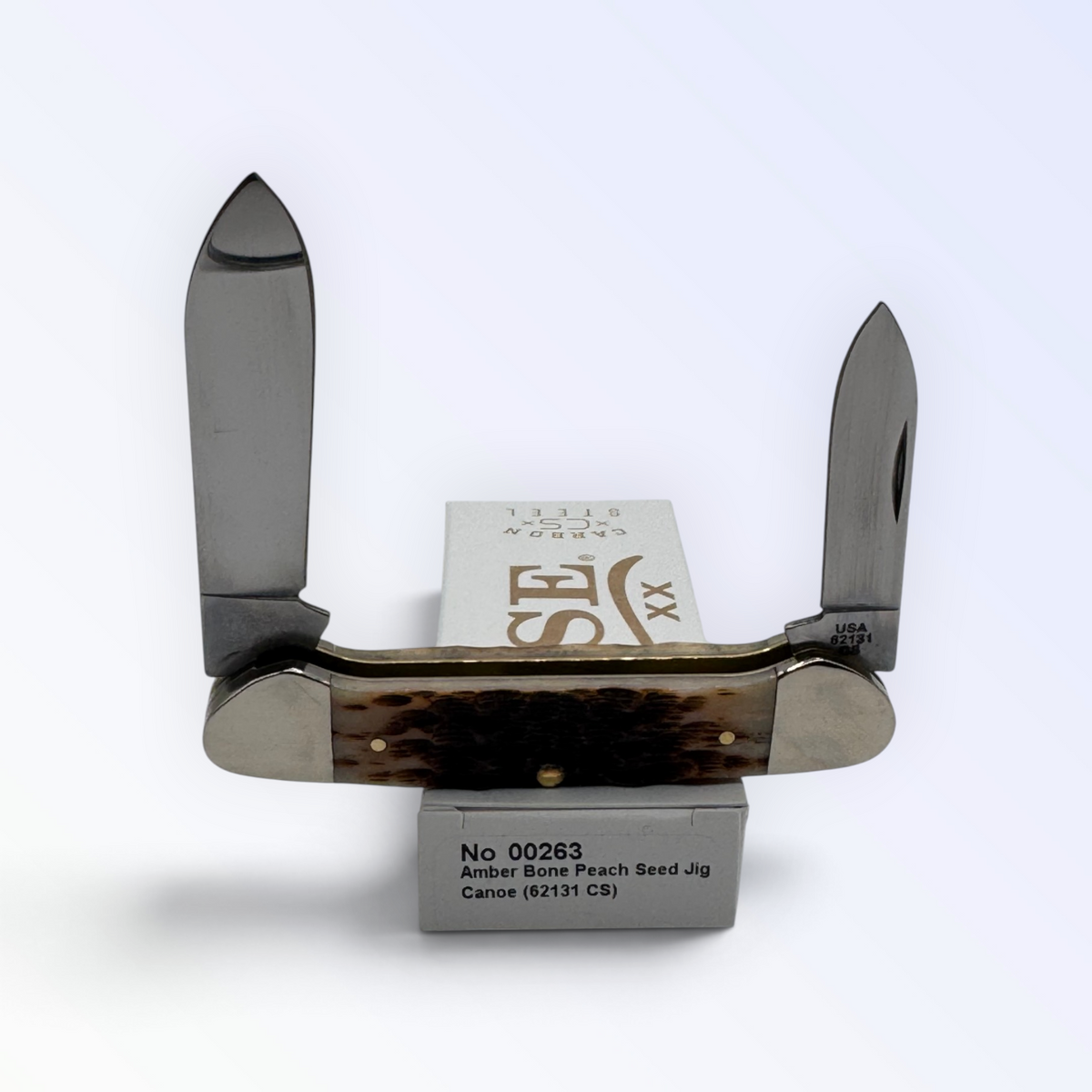 Pigeon Roost Knives Case XX Canoe pocket knife with amber bone peach seed jigged handle and dual carbon steel blades