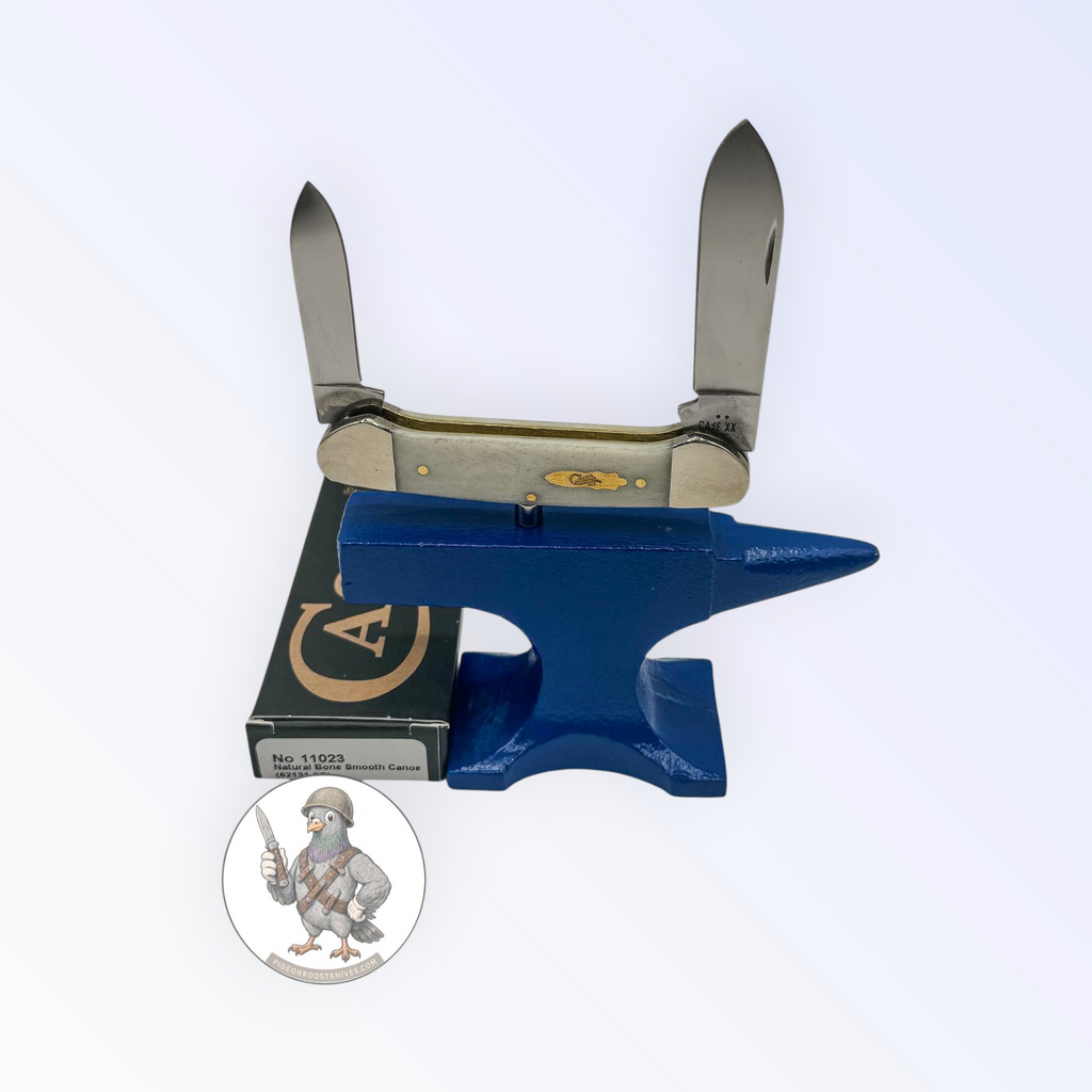 Case XX Canoe with smooth natural bone and dual stainless blades, SKU 11023 — blades open resting on the factory box