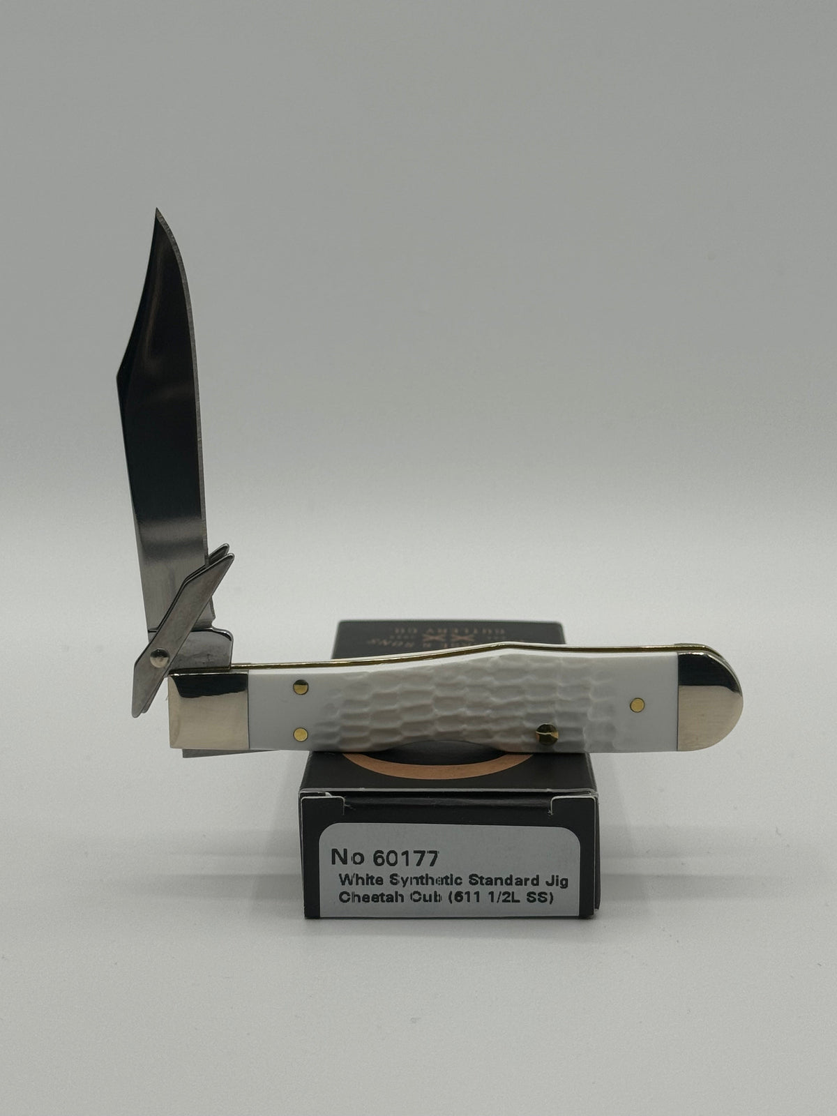 Pigeon Roost Knives Case XX SparXX Cheetah Cub pocket knife with white jigged synthetic handle and locking clip blade