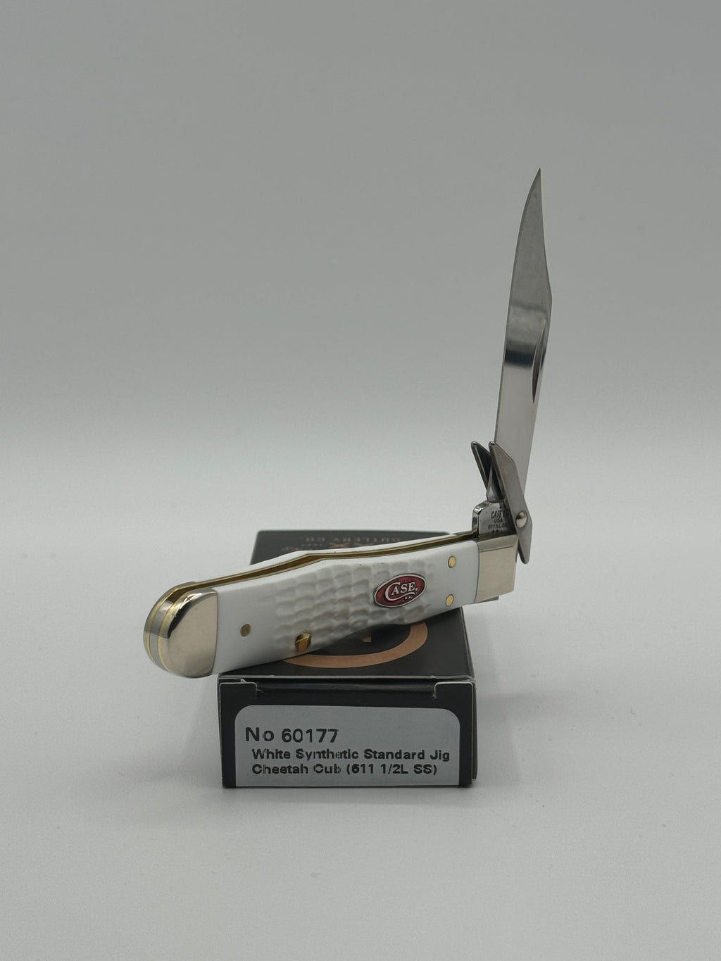 Pigeon Roost Knives Case XX SparXX Cheetah Cub pocket knife with white jigged synthetic handle and locking clip blade