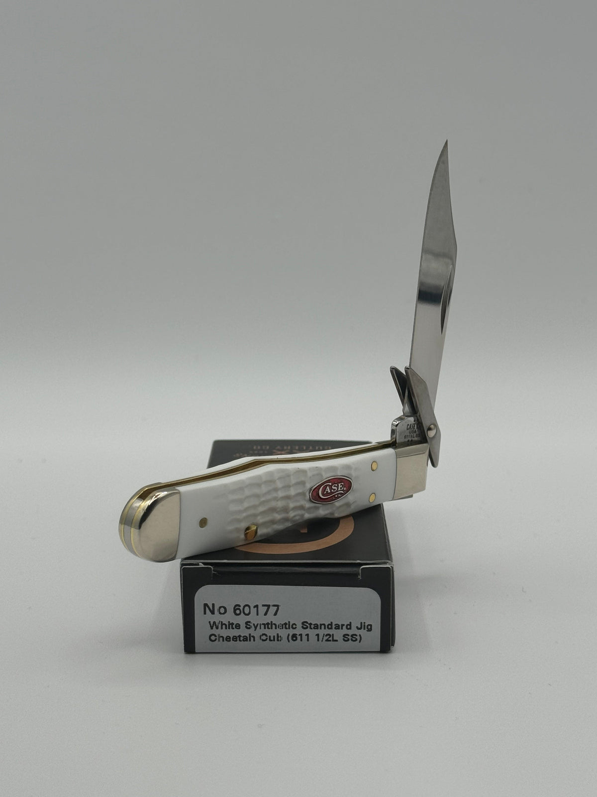 Pigeon Roost Knives Case XX SparXX Cheetah Cub pocket knife with white jigged synthetic handle and locking clip blade