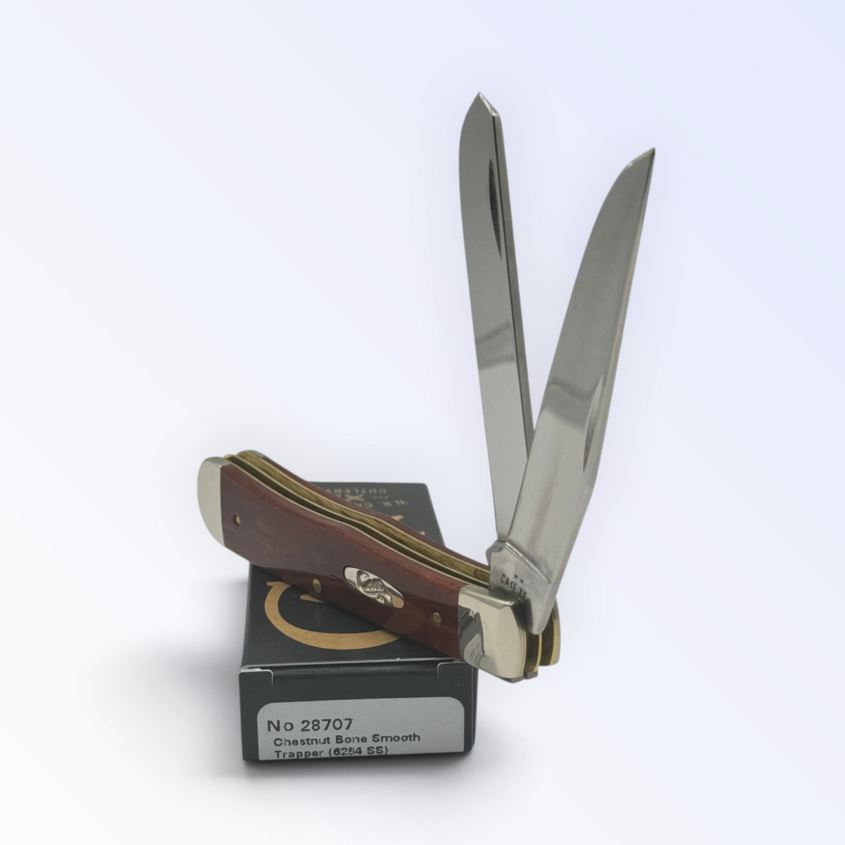 Case XX 28707 Chestnut Bone Trapper — angled open view on Case XX packaging