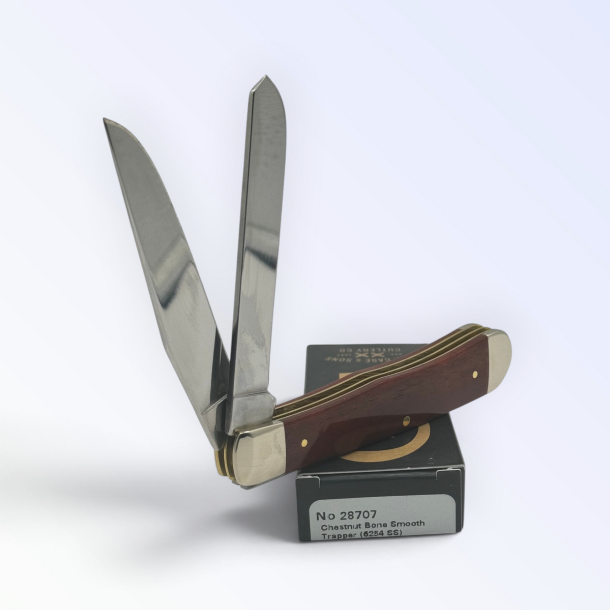 Case XX Chestnut Bone Trapper (28707) — pocket-knife studio shot on retail box