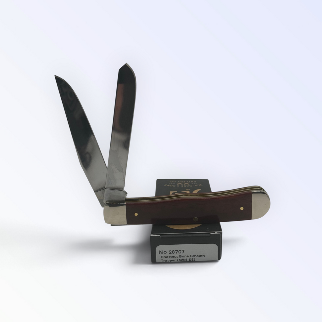 Chestnut Bone Trapper by Case XX (28707), close view of handle texture with blades open on box