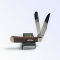Case XX Chestnut Bone Trapper with SKU 28707 — blades open resting on the factory box