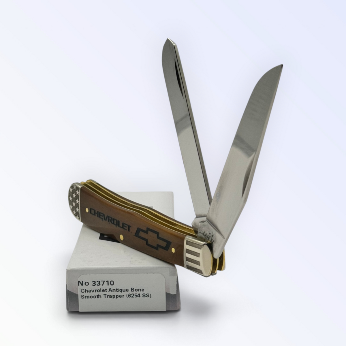 Case XX 33710 Chevrolet Embellished Antique Bone Trapper — angled open view on Case XX packaging