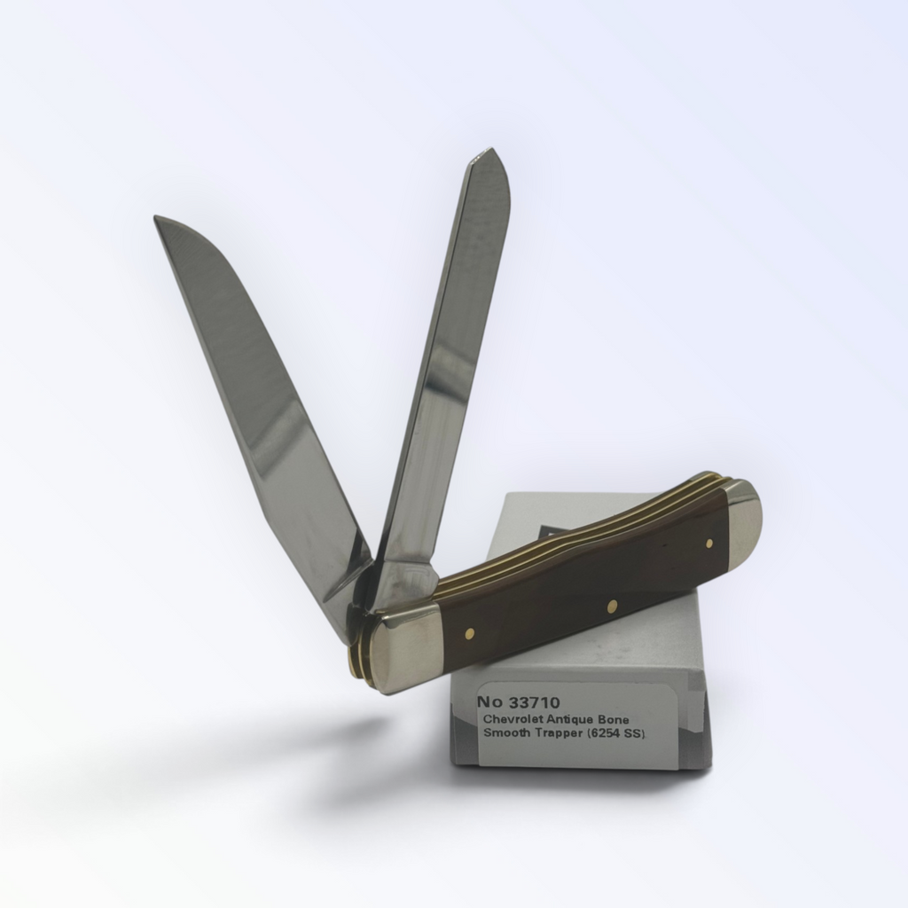 Case XX Chevrolet Embellished Antique Bone Trapper (33710) — pocket-knife studio shot on retail box