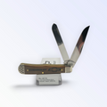Case XX Chevrolet Embellished Antique Bone Trapper with SKU 33710 — blades open resting on the factory box
