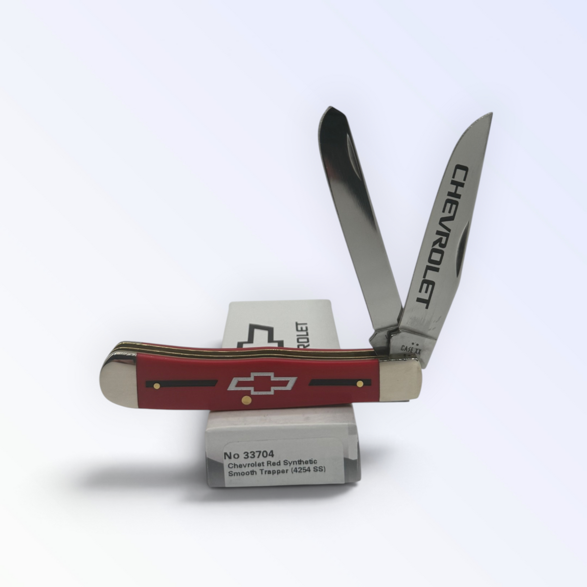 Case XX Chevrolet Red Synthetic Trapper with SKU 33704 — blades open resting on the factory box