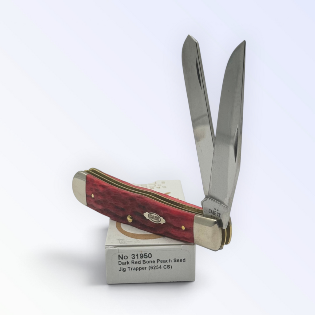 Case XX – Dark Red Bone Peach Seed Jig Trapper, SKU 31950 — closed profile on the Case XX box
