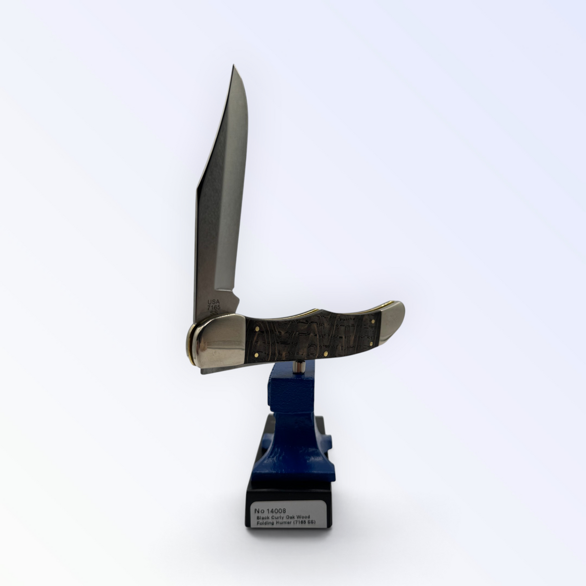 Catalog 14008 Case XX Folding Hunter — smooth black curly oak, close view of handle texture with blades open on box
